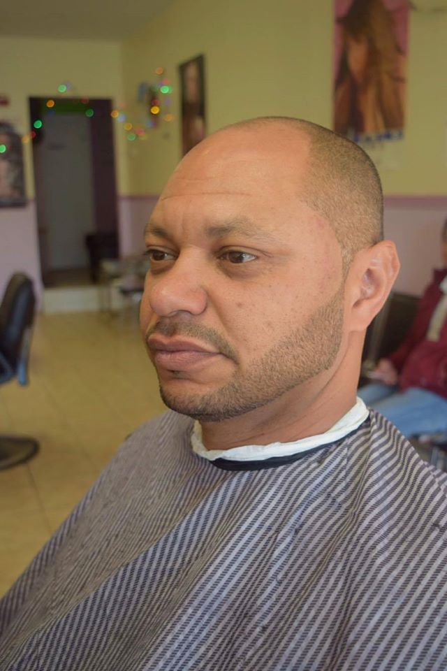 headshot showcasing a slick haircut