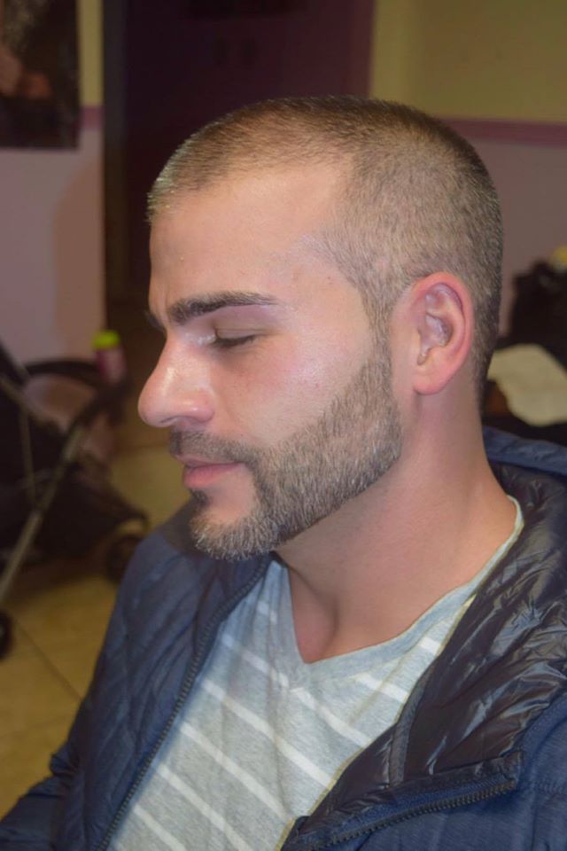 headshot showcasing a slick haircut